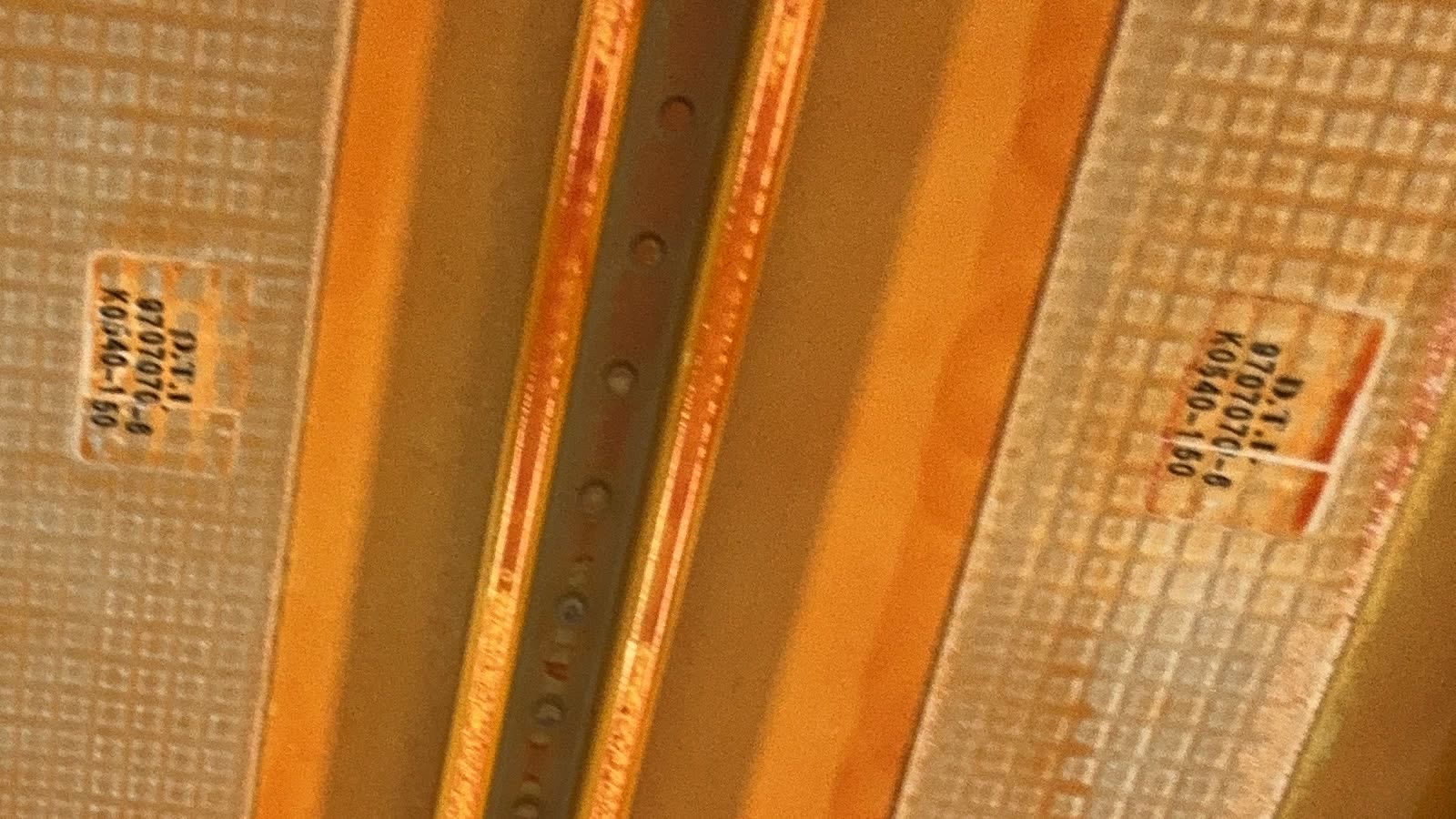 The same photo at full resolution: part markings stencilled on the skin panels